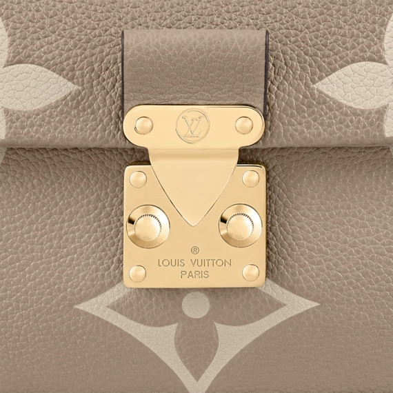 Make a statement with the Louis Vuitton Madeleine MM - the perfect accessory for any woman