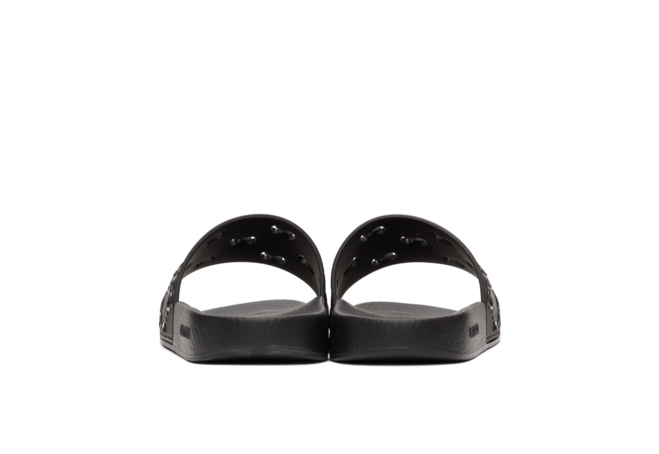 Make a Statement with Gucci Black Rubber GG Slides for Women's!